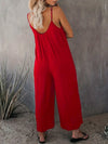 Elegante schwarze damen-jumpsuit mit weitem bein und spaghetti-träger