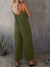 Elegante schwarze damen-jumpsuit mit weitem bein und spaghetti-träger