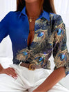 Damen bluse mit pfauenfeder-druck - elegante musterbluse