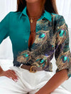Damen bluse mit pfauenfeder-druck - elegante musterbluse
