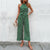 Grüner pünktli jumpsuit - trendy halterneck design für damen
