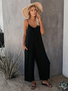Elegante schwarze damen-jumpsuit mit weitem bein und spaghetti-träger