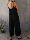 Elegante schwarze damen-jumpsuit mit weitem bein und spaghetti-träger