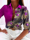 Damen bluse mit pfauenfeder-druck - elegante musterbluse
