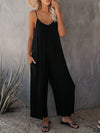 Elegante schwarze damen-jumpsuit mit weitem bein und spaghetti-träger