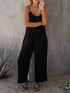Elegante schwarze damen-jumpsuit mit weitem bein und spaghetti-träger