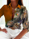 Damen bluse mit pfauenfeder-druck - elegante musterbluse