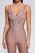 Ausgestellter spaghetti-träger bandage-jumpsuit in aprikosenfarbe - elegante damenmode